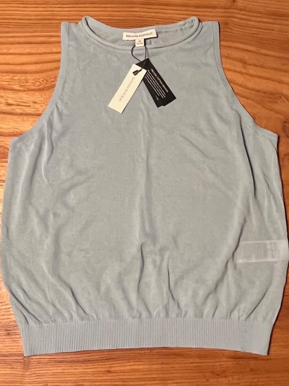 Banana Republic sheer light blue sleeveless vest.
